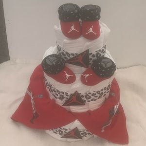 New 3 tier Jordan baby diaper cake. All new 30 diapers, 2 shoes, 2 baby bibs